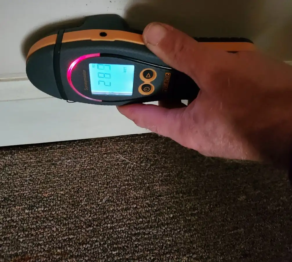 Moisture detection at baseboard during Burst Pipe Cleanup in Layton